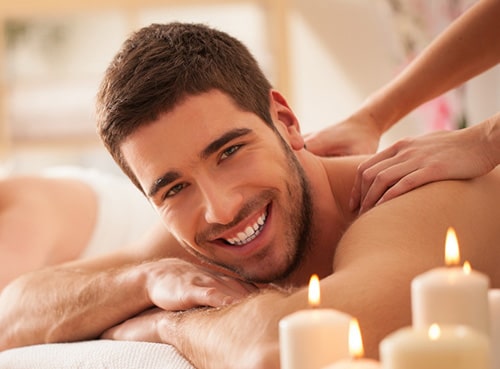 male client is feeling relaxed with a massage therapy
